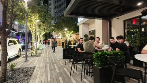People out at night having drinks in Brickell Miami Stock Footage 344976689