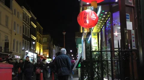 People outside restaurant looking at menu in China Town Stock Footage 46942690