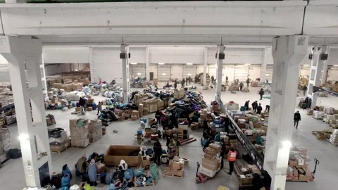 People pack and sort humanitarian aid for refugees Stock Footage 204070586
