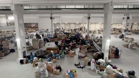 People pack and sort humanitarian aid for refugees Stock Footage 204070592