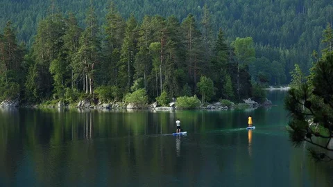 People paddleboarding Stock Footage 129684780