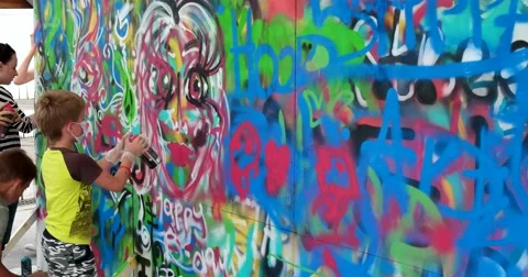 People paint graffiti Stock Footage 64820563