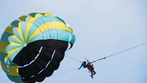 People on a parachute in the sky Stock Footage 203806439