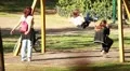 People at park - child on swing HD Footage
