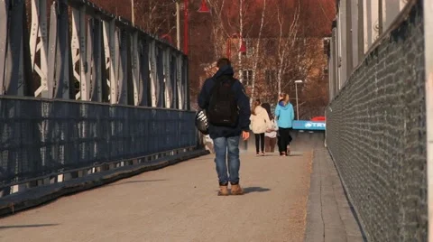 People pass by the bridge in in Trysil, Norway. Stock Footage 61471069