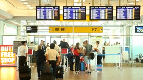 People pass passport control on exit to gates of Ruzyne airport Stock Footage 6374560