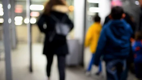 People pass through a metal detector at the entrance to metro.Blurred Video stock 102475339