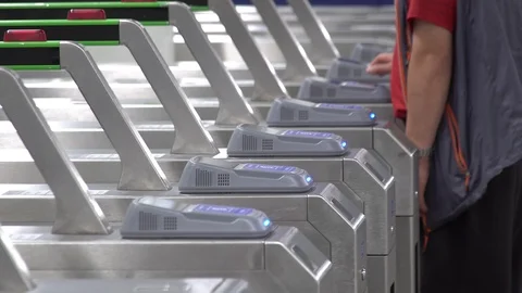 People Pass Through Pay Gate in Subway Stock Footage 90555936