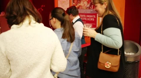 People pass ticket control at the entrance to the auditorium Stock Footage 64816323