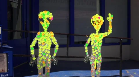 People pass by two alien figures in front of the International UFO Museum and Re Stock-Footage 61855774