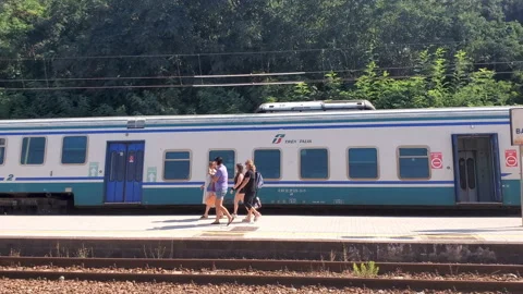 People passengers get off from train with protective masks,coronavirus transport Stock Footage 135507898