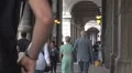People passing by archway Bologna Italy ancient icon narrow passage old town day HD Footage