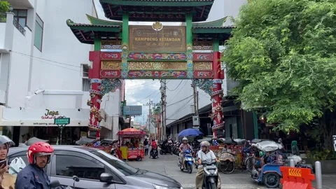 People passing by around the gate of Ketandan village in Malioboro, Yogyakarta Stock Footage 297030980