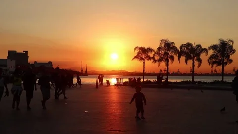People passing by during sunset in Praça Mauá - Rio de Janeiro - Brazil Stock Footage 78617861