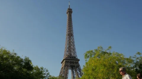 People passing the Eiffel Tower view from the Avenue Joseph-Bouvard Stock Footage 95867090
