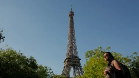 People passing the Eiffel Tower view from the Avenue Joseph-Bouvard Stock Footage 95867111