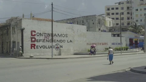 People passing near the revolutionary mural Stock Footage