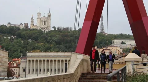 People passing over the bridge on the river Saone. France, Lyon Stock Footage 47828206