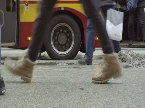 PEOPLE PASSING BY ON THE PAVEMENT Stock Footage 69635334