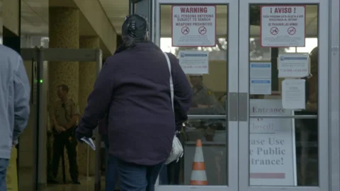 People Passing Through Courthouse Security Entrance Vídeos de archivo 343959674