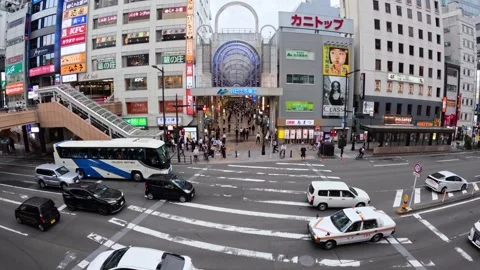 People passing through an intersection Stock Footage 243426829