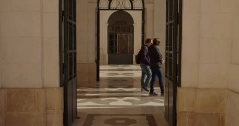 People passing through an open door Stock Footage 254006590