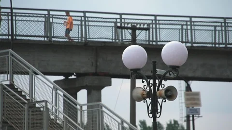 People passing through the overhead passage in the old railway station Stock Footage 111947205