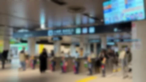 People passing through ticket gates at Odori subway station in Sapporo, Japan Vídeo Stock 330249570