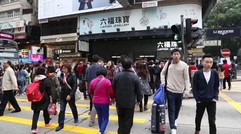 People on a pedestrian crossing in the central district of Hong Kong Stock-Footage 48951187