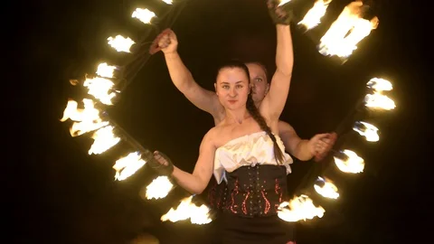 People perform a fireshow at night Stock Footage 128971771