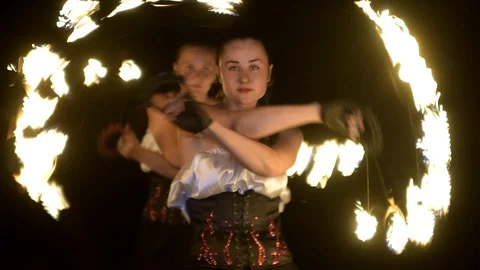 People perform a fireshow at night Stock Footage 128971829