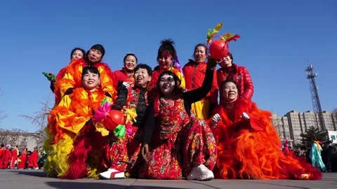 People perform lion dances on the square to celebrate the traditional Chine.. Stock Footage 301830112
