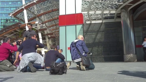 People perform an outdoor training workshop in Gae Aulenti Square, Milan, Italy. Stock Footage 83244634