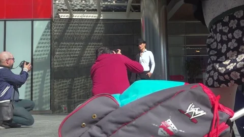 People perform an outdoor training workshop in Gae Aulenti Square, Milan, Italy. Stock Footage 83249645