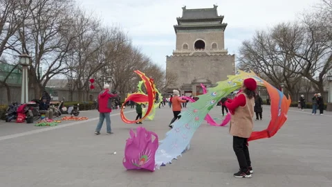 People performing ribbon dance in front of tourism spot Bell Tower,Beijng,China. Stock Footage 231690026