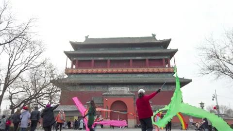 People performing ribbon dance in front of tourism spot Bell Tower,Beijng,China. Stock Footage 231690183