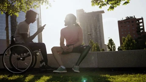  People with physical disabilities using mobile phone - Diversity friendship Stock Footage 238409262