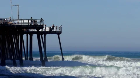 People on Pier Fish Watch Waves MS Video stock 78079636