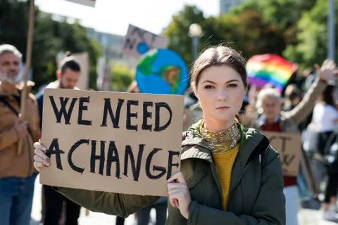 People with placards and posters on global strike for climate change. Stock Photos