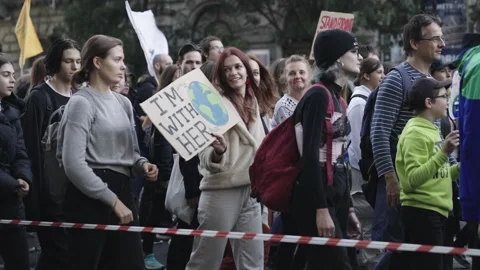 People with placards march in a column Stock Footage 197329099