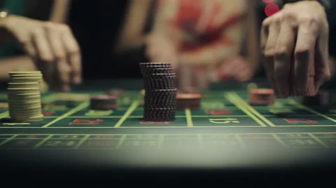 People placing bets for roulette in casino. Slider camera movement Stock Footage