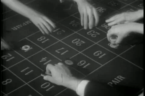 People placing bets at roulette table Stock Footage 11352955
