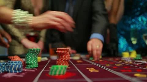 People placing their bets on roulette table Stock Footage 12288981