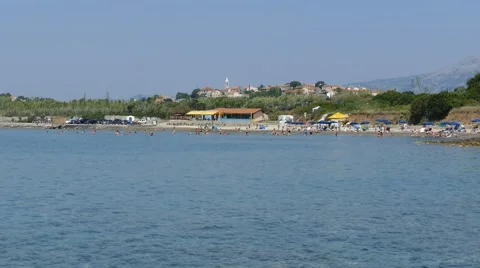 People Plaing on Sandy Beach Stock Footage 53869149