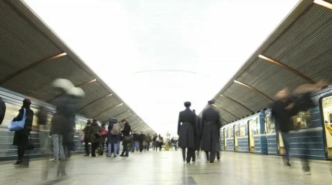 People on platform on station of subway, two trains arrive and leave Stock Footage 665704