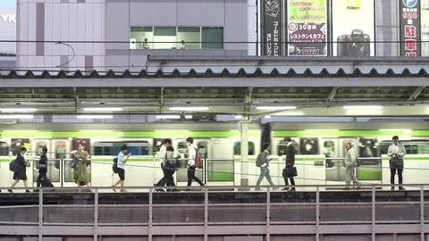 People on platform at a Tokyo train station Stock Footage 74167102