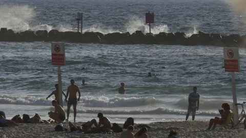 People Play At The Beach At Sunset Stock Footage 90100610