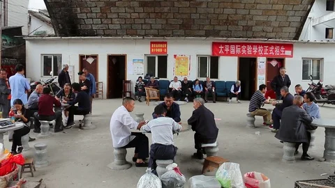People Play Games In Playing Area In Chinese Town Stock Footage 86989935
