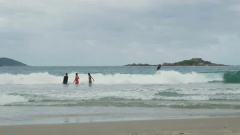 People playing on beach Stock Footage