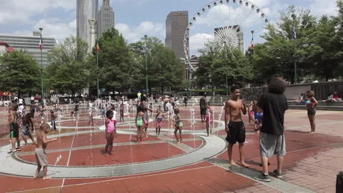People playing in fountain in Olympic Park, Atlanta. Stock Footage